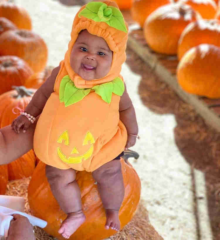 Image of a child dressed as a pumpkin