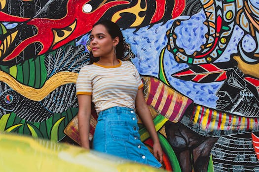 Young woman stands against colorful street art in Panama City, Panama.